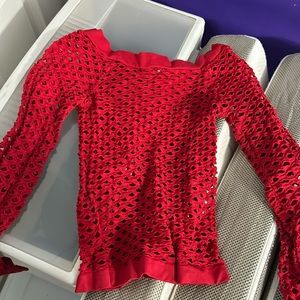 Red long sleeve holes top. Very stretchy